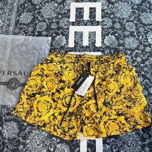 Versace Black and Yellow Floral Athletic swim trunks